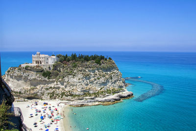 High angle view of sea against blue sky