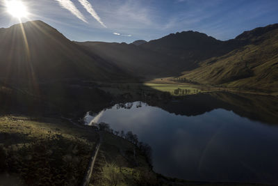 Scenic view of lake and mountains against sky