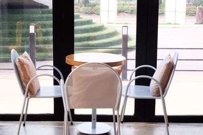 Empty chairs and table in restaurant