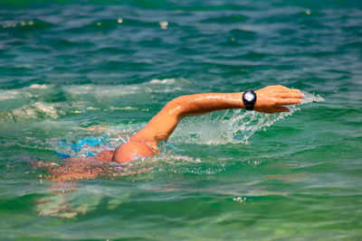 High angle view of man swimming in sea