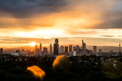 Cityscape against sky during sunset