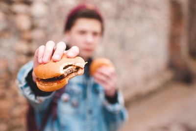 Portrait of woman holding food