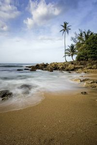 Scenic view of sea against cloudy sky