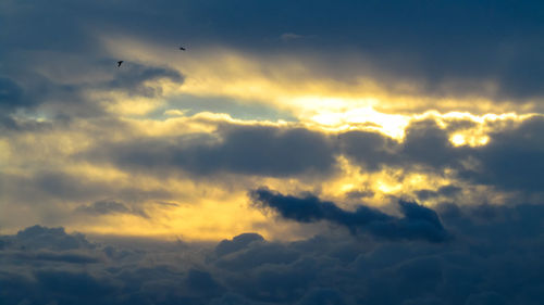 Low angle view of clouds in sky during sunset