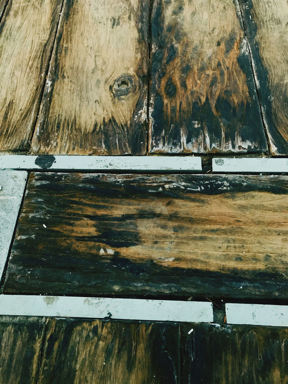 CLOSE-UP OF OLD WOODEN TABLE
