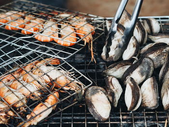 High angle view of meat on barbecue grill