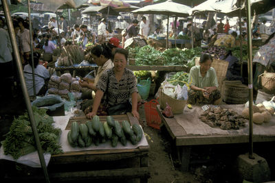 People at market stall