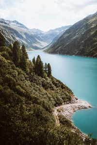 Scenic view of lake and mountains against sky