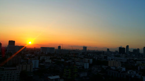 High angle view of buildings against sky during sunset