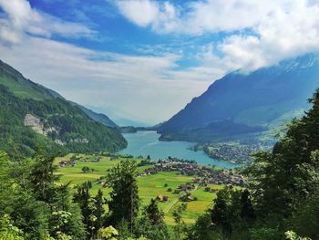 Scenic view of mountains against cloudy sky