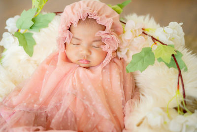 Beautiful baby girl wearing muslim costume. fast asleep.