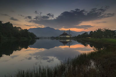 Scenic view of lake at sunset