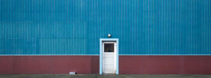 Closed blue door of building