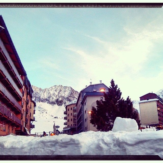 snow, winter, cold temperature, season, building exterior, architecture, built structure, weather, covering, house, sky, mountain, snowcapped mountain, tree, residential structure, covered, nature, white color, frozen, cloud - sky