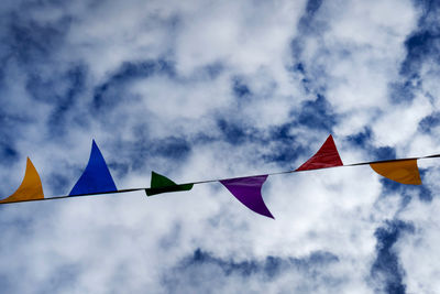Low angle view of bunting against sky