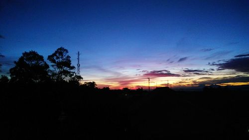 Scenic view of silhouette landscape against sky at sunset