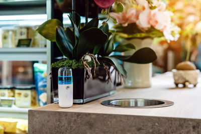 Close-up of flower vase on table