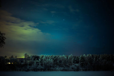Scenic view of landscape against sky at night