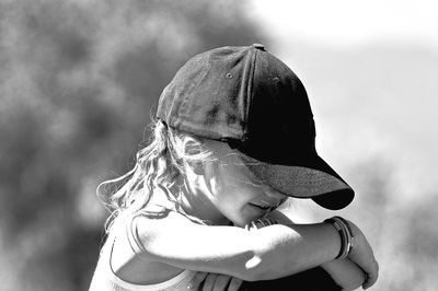 Close-up of girl wearing cap