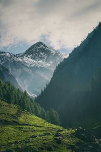 Scenic view of snowcapped mountains against sky