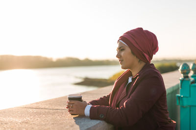 Portrait of young woman using mobile phone