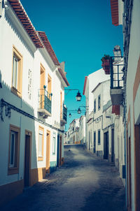 View of residential buildings against clear sky