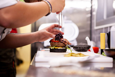 Midsection of person preparing food