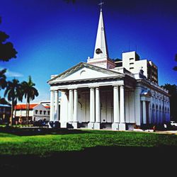 Low angle view of church against blue sky