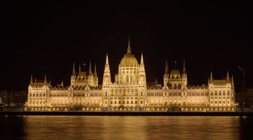 Illuminated buildings at waterfront