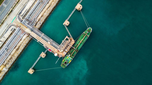 Aerial view of cargo container moored at dock