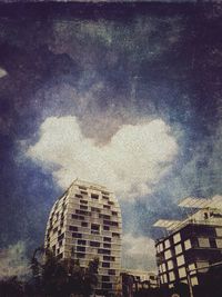 View of buildings against cloudy sky