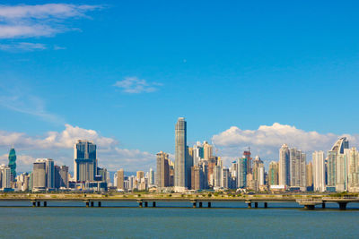 View of city skyline against blue sky