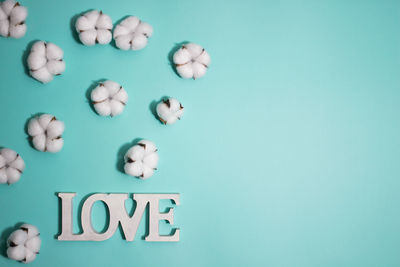 Directly above shot of pills against blue background