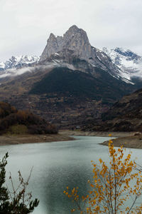 Scenic view of lake and mountains against sky