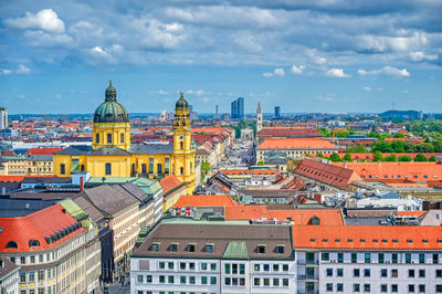 High angle view of buildings in city against sky