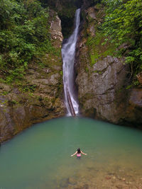 Scenic view of waterfall in sea