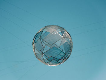 Low angle view of telephone pole against blue sky