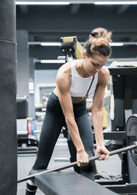 Female athlete exercising in gym