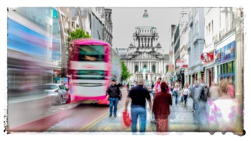 Group of people walking on city street