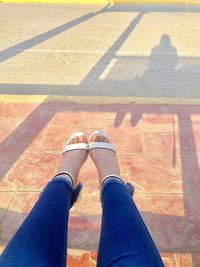 Low section of woman on tiled floor