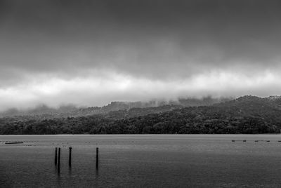 Scenic view of mountains against cloudy sky