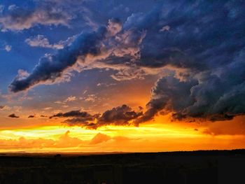 Scenic view of dramatic sky during sunset