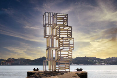 Structure made of cubes and fluorescent light tubes at the edge of tagus river in lisbon, portugal