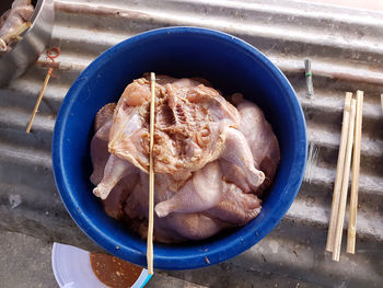 High angle view of meat in container on table