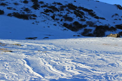 Scenic view of snow covered landscape against sky