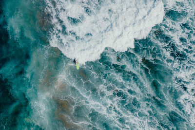Aerial view of person surfing on sea