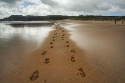 Scenic view of beach against sky