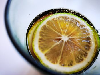 Directly above shot of drink in glass against white background