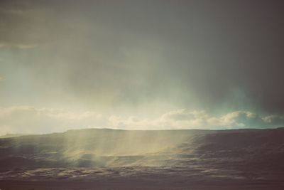 Scenic view of storm clouds over sea