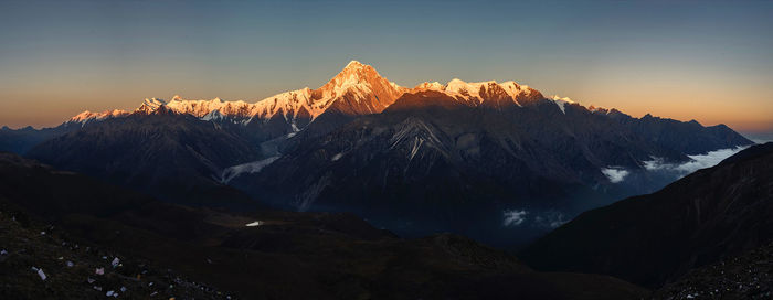 Scenic view of mountains against sky during sunset